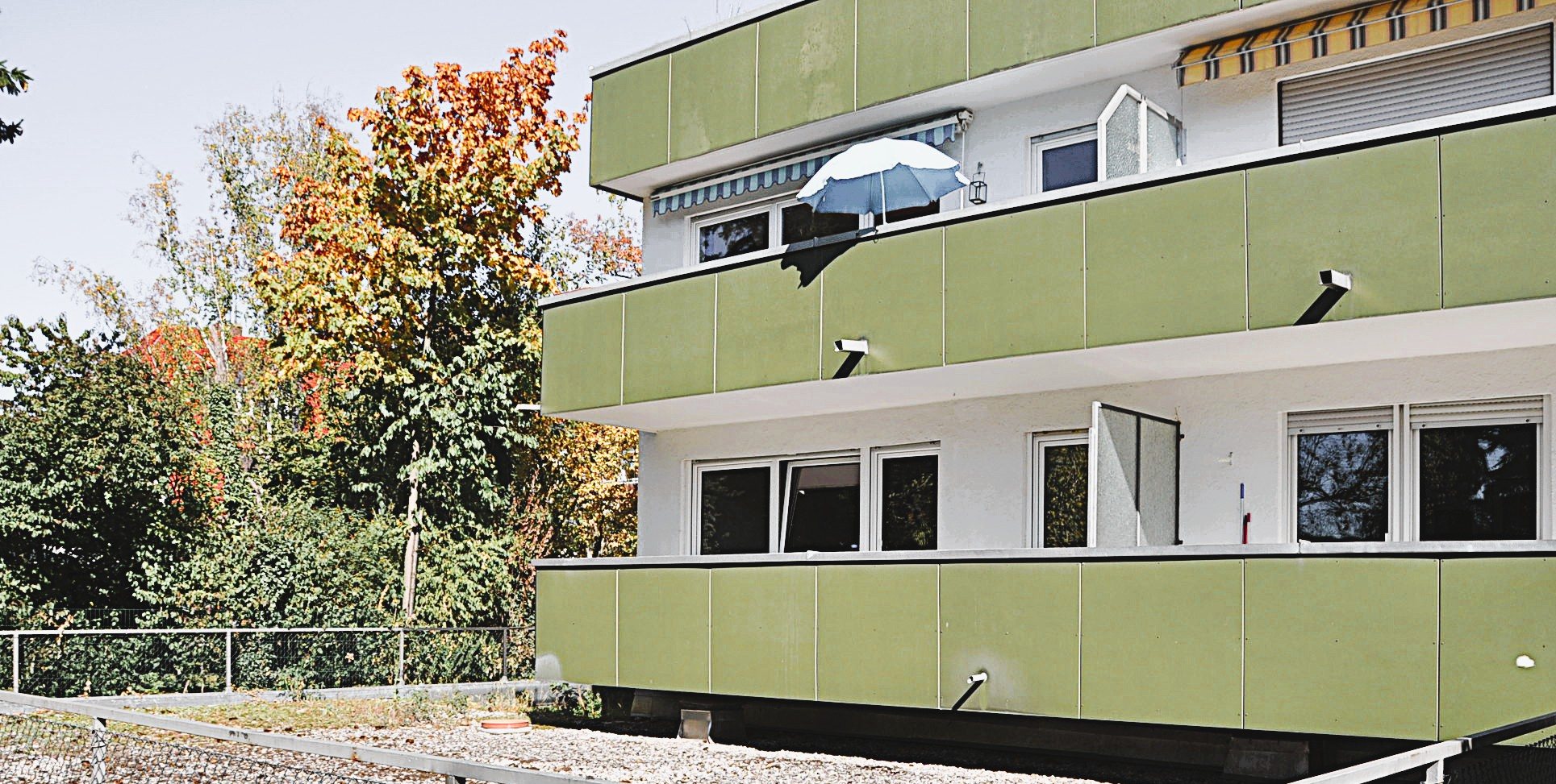 Building on park-like grounds, rear view