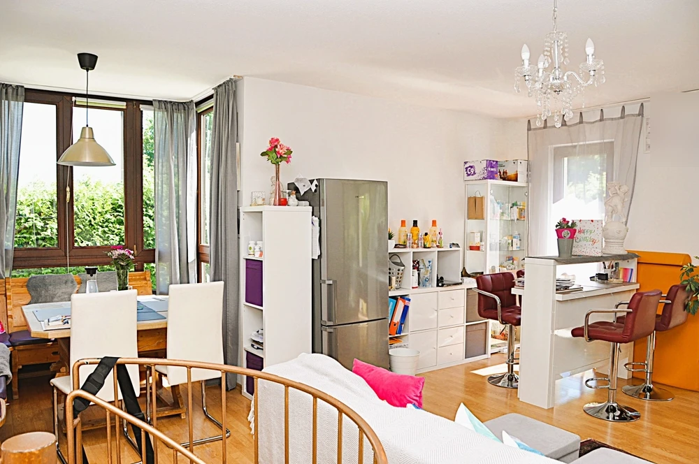 Living and dining area with large windows