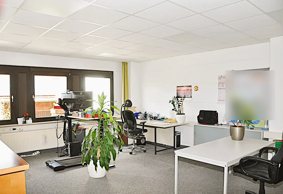 Open-plan office on the first floor with several workstations