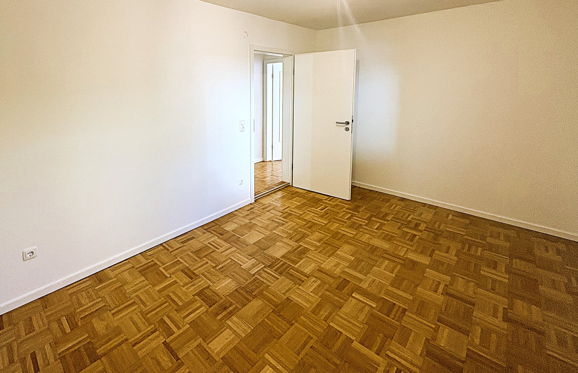 Bedroom with parquet flooring
