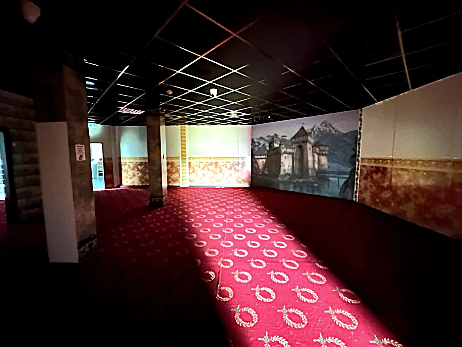 Enclosed room with red floor covering
