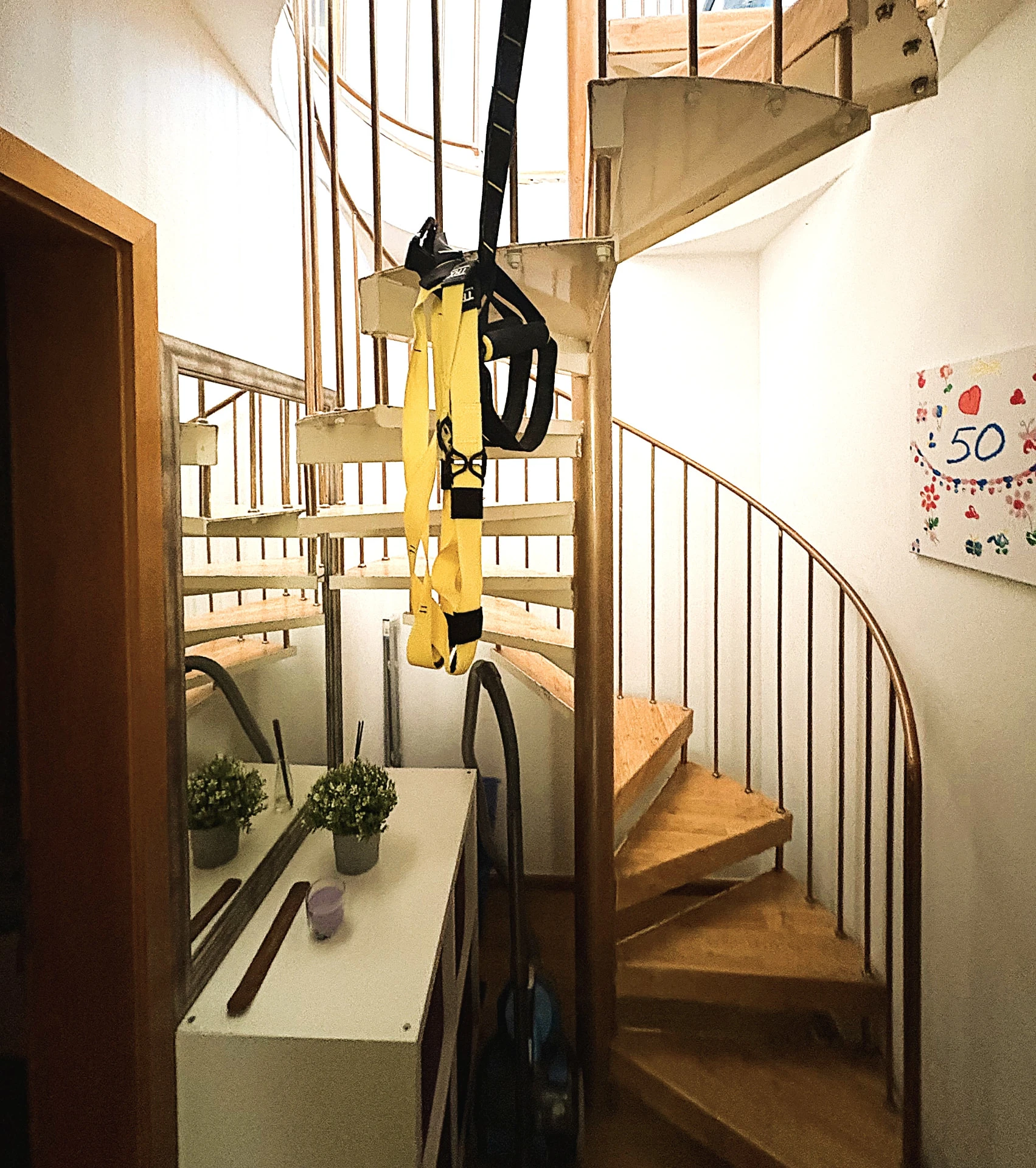 Wooden spiral staircase to the lower ground floor