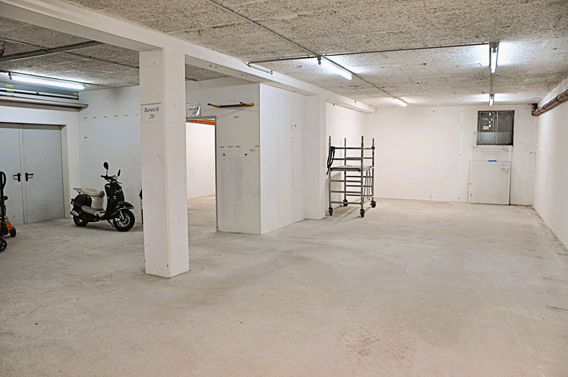 Open storage area with structural columns and ancillary spaces
