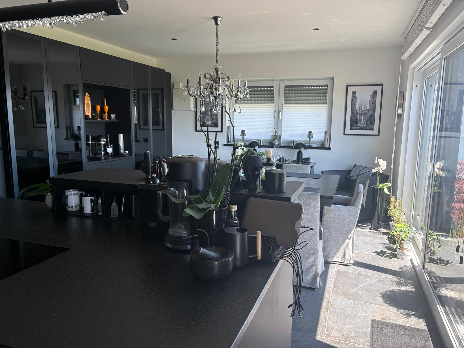 Dining area with chandelier and generous window front