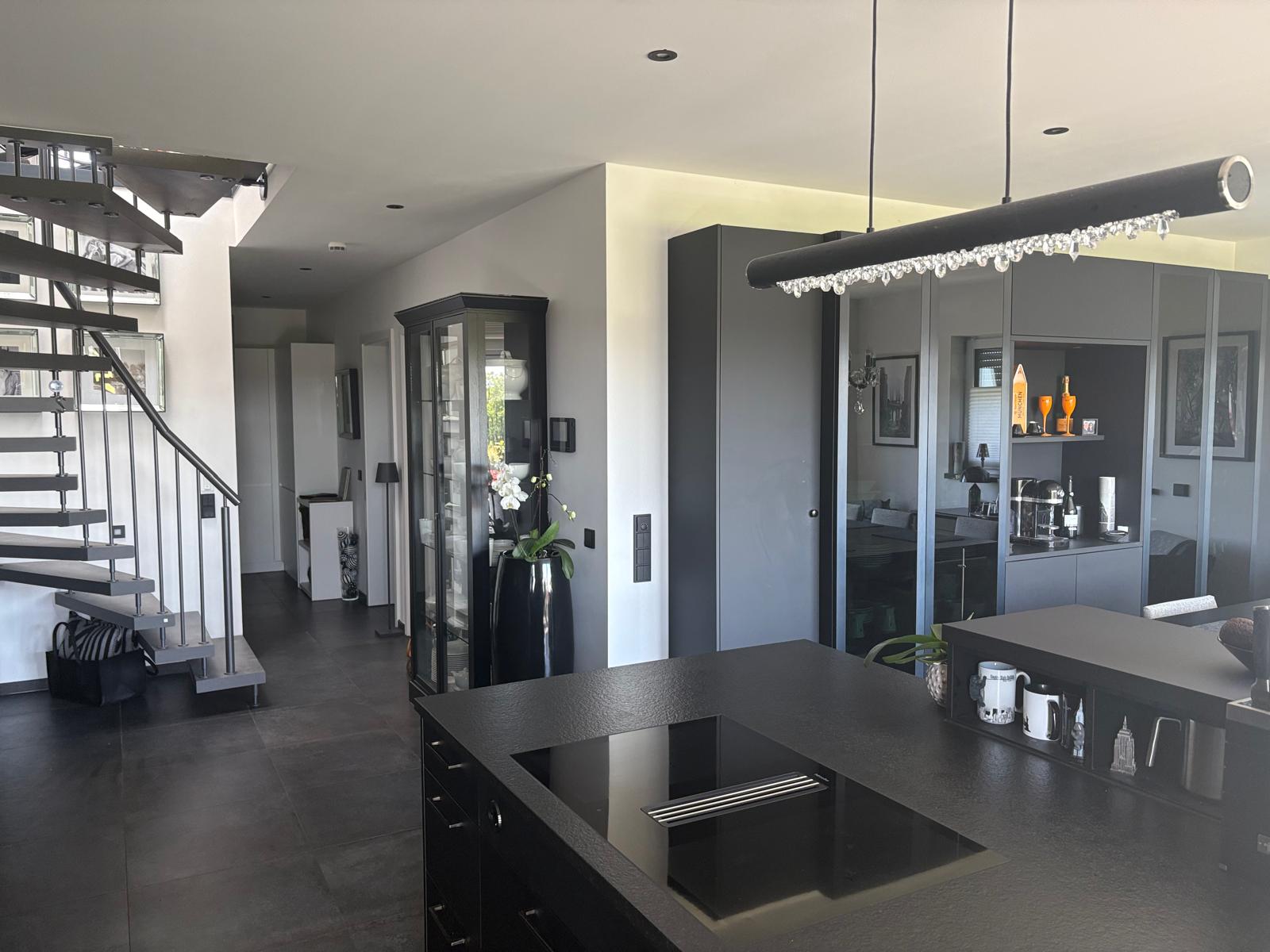 Designer staircase to the gallery floor and open kitchen
